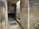 Fouilles archéologiques de l'abri bétonné du Moulin de Laffaux (Aisne). Le couloir d’accès, le départ de l’escalier et le puisard.